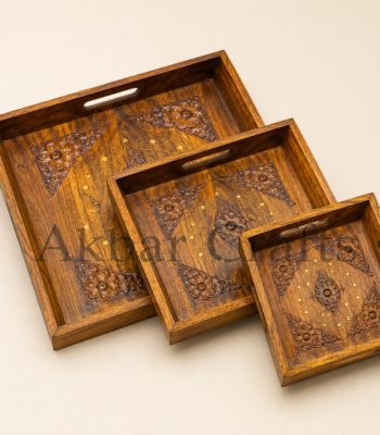 Sheesham wooden serving trays holding tea cups glasses and dates